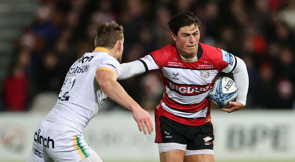 GLOUCESTER, ENGLAND - DECEMBER 23:  Louis Rees-Zammit of Gloucester is tackled by Rory Hutchinson during the Gallagher Premiership Rugby match between Gloucester Rugby and Northampton Saints at Kingsholm Stadium on December 23, 2023 in Gloucester, England. (Photo by David Rogers/Getty Images)