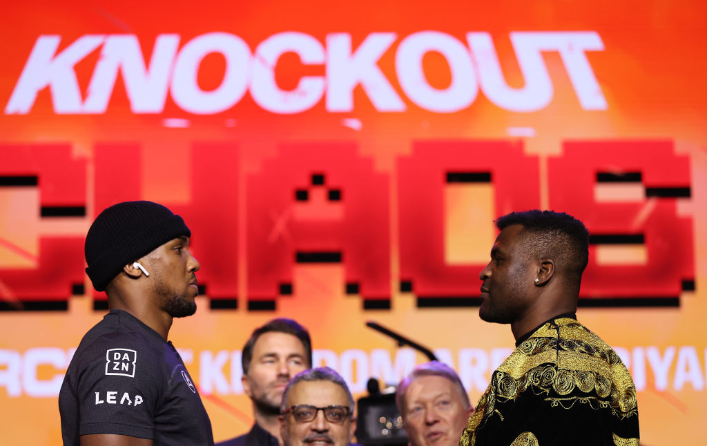 LONDON, ENGLAND - JANUARY 15: Anthony Joshua and Francis Ngannou face off during the Anthony Joshua v Francis Ngannou Press Conference at Outernet London on January 15, 2024 in London, England. (Photo by Alex Pantling/Getty Images)