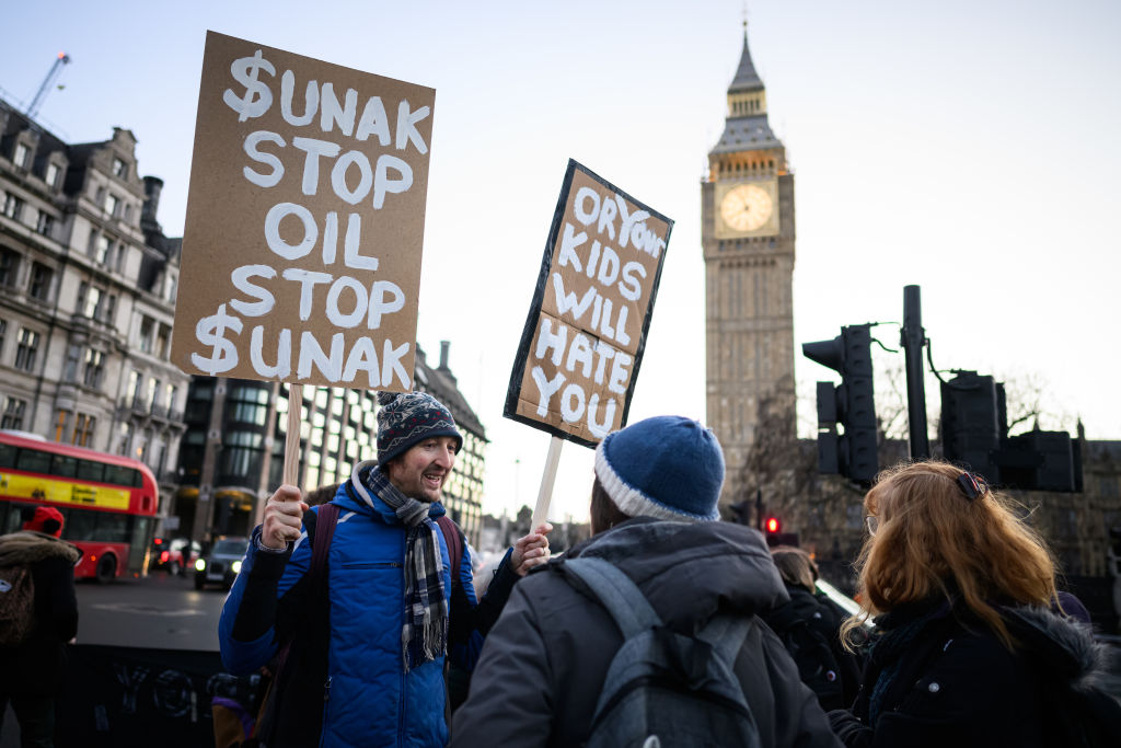 LONDON, ENGLAND - JANUARY 22: Just Stop Oil campaigners gather to protest against the Offshore Licensing Bill in Parliament Square on January 22, 2024 in London, England. (Photo by Leon Neal/Getty Images)