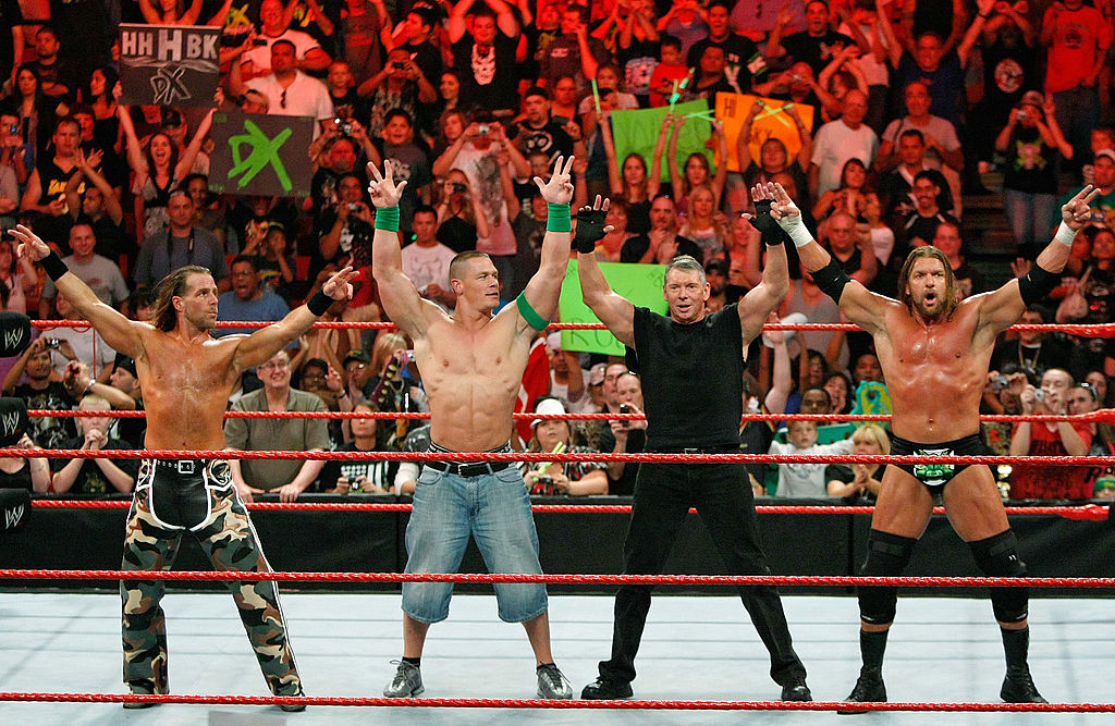 LAS VEGAS - AUGUST 24:  (L-R) Wrestler Shawn Michaels, World Wrestling Entertainment Inc. Chairman Vince McMahon, and wrestlers John Cena and Triple H pose in the ring during the WWE Monday Night Raw show at the Thomas & Mack Center August 24, 2009 in Las Vegas, Nevada.  (Photo by Ethan Miller/Getty Images)