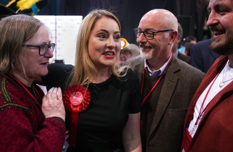 Labour Party candidate Gen Kitchen celebrates with her family after being declared winner in the Wellingborough by-election at the Kettering Leisure Village, Northamptonshire.

