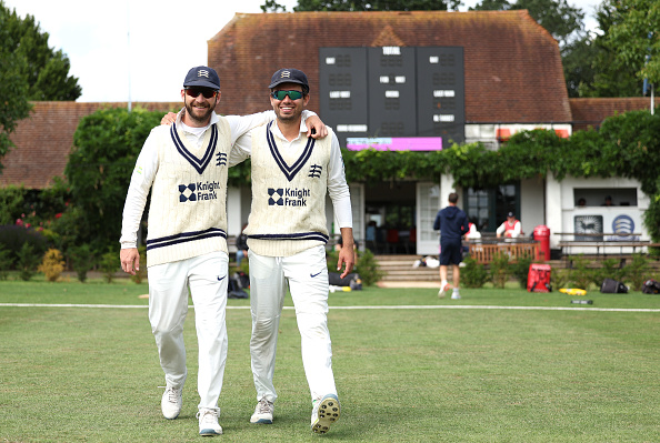 NORTHWOOD, ENGLAND - JULY 12: Pieter Malan and Max Holden of Middlesex walk out together during the LV= Insurance County Championship Division 1 match between Middlesex and Northamptonshire at Northwood, England. (Photo by Warren Little/Getty Images)