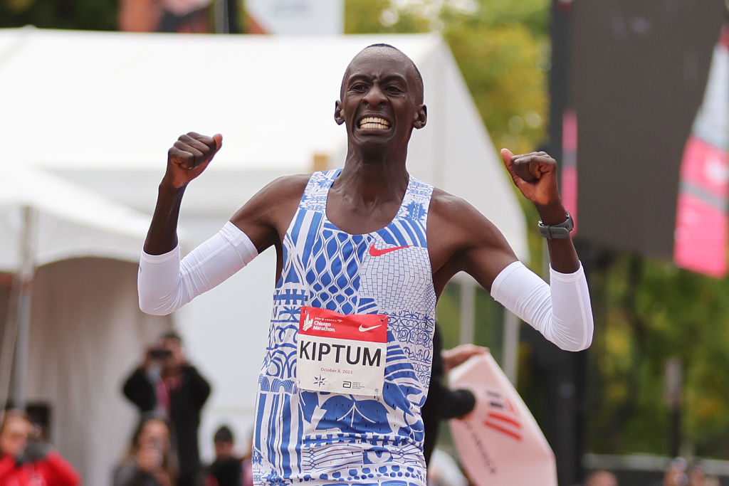 CHICAGO, ILLINOIS - OCTOBER 08: Kelvin Kiptum of Kenya celebrates as he crosses the finish line to win the 2023 Chicago Marathon professional men's division and set a world record marathon time of 2:00.35 on October 08, 2023 in Chicago, Illinois. (Photo by Michael Reaves/Getty Images)