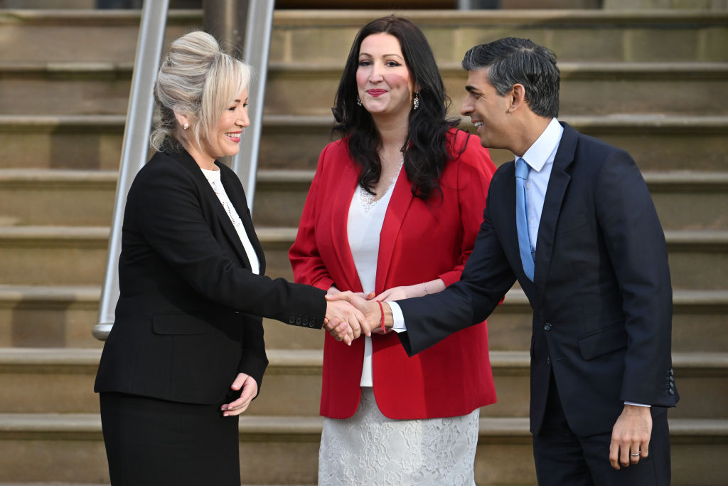 BELFAST, NORTHERN IRELAND - FEBRUARY 5:  First Minister of Northern Ireland, Michelle O'Neill, and Deputy First Minister of Northern Ireland, Emma Little-Pengelly, greet Prime Minister Rishi Sunak as he arrives at Stormont Castle on February 5, 2024 in Belfast, Northern Ireland. (Photo by Charles McQuillan/Getty Images)