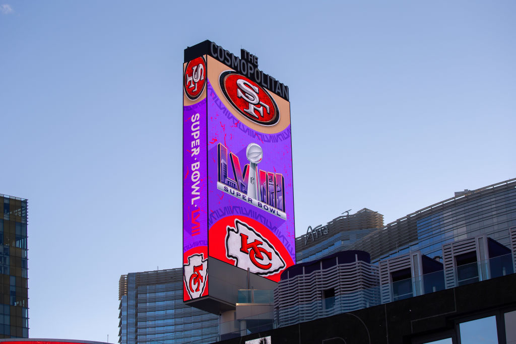 LAS VEGAS, NEVADA - FEBRUARY 10: A commercial sign show the logos of the Super Bowl LVIII, the San Francisco 49ers and the Kansas City Chiefs ahead of Super Bowl LVIII on February 10, 2024 in Las Vegas, Nevada. (Photo by Mario Hommes/DeFodi Images via Getty Images)