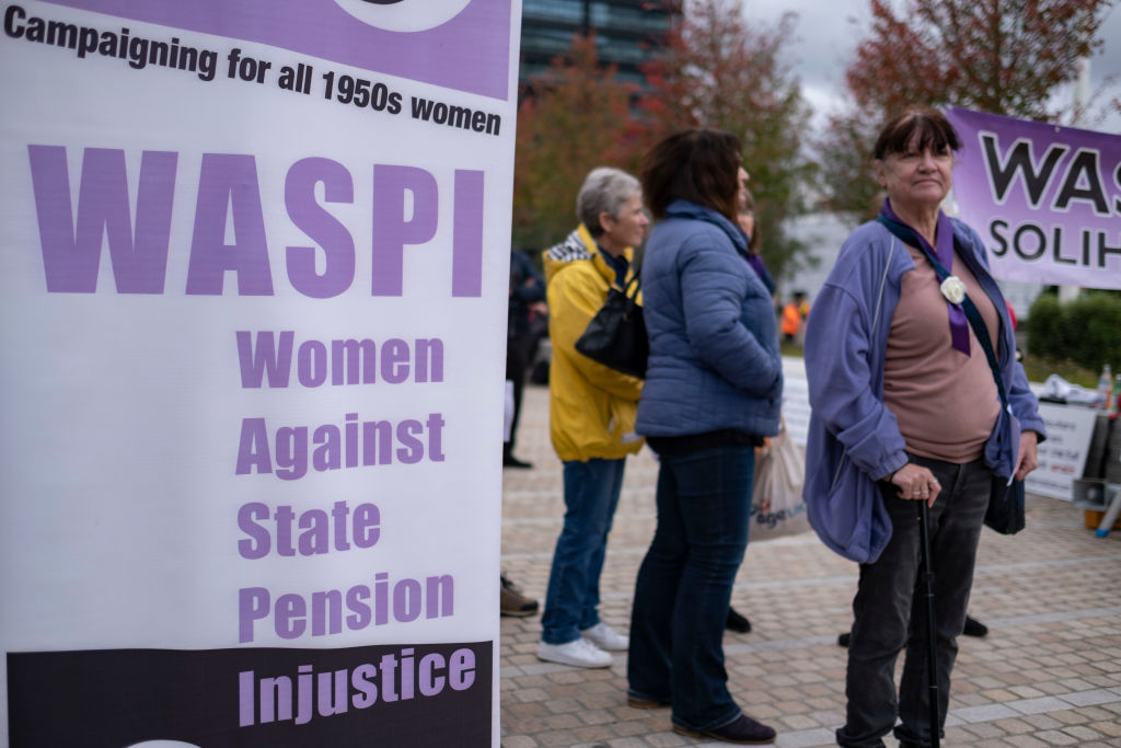 WASPI women protest outside the Conservative Party Conference at the ICC on 4rd October 2022 in Birmingham, United Kingdom. Women Against State Pension Inequality is a voluntary UK-based organisation founded in 2015 that campaigns against the way in which the state pension age for men and women was equalised. They call for the millions of women affected by the change to receive compensation. (photo by Mike Kemp/In Pictures via Getty Images)