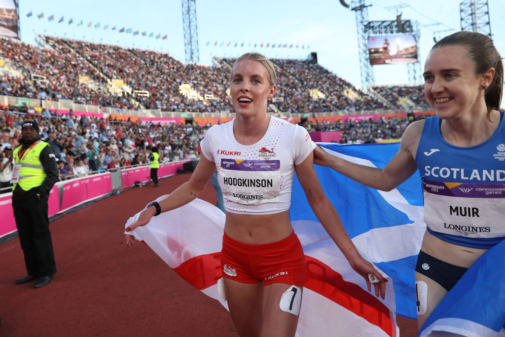 BIRMINGHAM, ENGLAND - AUGUST 6:  Keely Hodgkinson alongside Scotland's Laura Muir during the lap of honour after claiming silver in the women's 800m final on day nine of the Commonwealth Games at Alexander Stadium on August 6, 2022 in Birmingham, England. English athlete Keely Hodgkinson specialises in the 800 metres. At the age of 19, she won silver at the 2020 Tokyo Olympics, breaking the British record set by Kelly Holmes. She added the European indoor and outdoor titles and claimed silver in the World Championships and Commonwealth Games in 2022. Coached by Trevor Painter this story follows her from January 2022 towards the summer Olympics in Paris 2024 (Photo by Michael Steele/Getty Images)