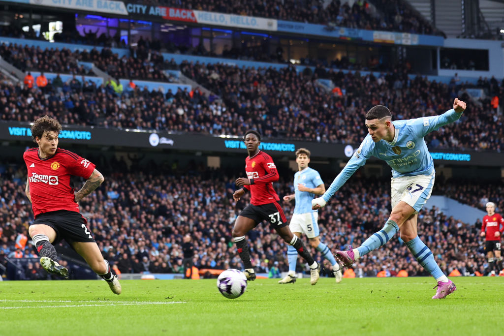 Phil Foden double wins Manchester derby and keeps City in touch at top