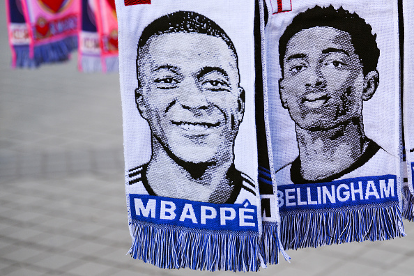 MADRID, SPAIN - MARCH 06: Scarves of Kylian Mbappe and Jude Bellingham hang in a souvenir stall outside the stadium prior to the UEFA Champions League 2023/24 round of 16 second leg match between Real Madrid CF and RB Leipzig at Estadio Santiago Bernabeu on March 06, 2024 in Madrid, Spain. (Photo by David Ramos/Getty Images)