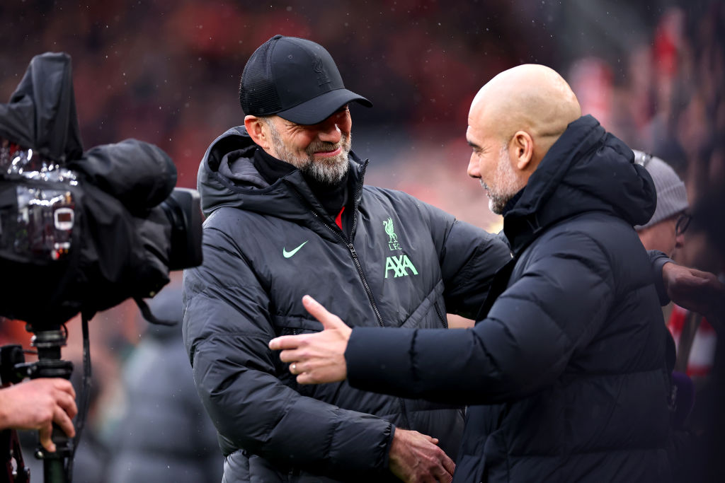 LIVERPOOL, ENGLAND - MARCH 10: Jurgen Klopp, Manager of Liverpool, (L) embraces Pep Guardiola, Manager of Manchester City, prior to the Premier League match between Liverpool FC and Manchester City at Anfield on March 10, 2024 in Liverpool, England.(Photo by Robbie Jay Barratt - AMA/Getty Images)