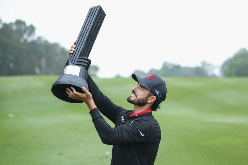 HONG KONG, CHINA - MARCH 10: Abraham Ancer of FIREBALLS GC celebrates with the trophy after win the first place during day three of the LIV Golf Invitational - Hong Kong at The Hong Kong Golf Club on March 10, 2024 in Hong Kong, China. (Photo by Lintao Zhang/Getty Images)