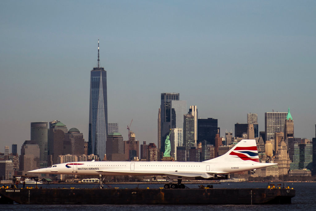 A retired British-Airways Concorde supersonic airliner is moved on a barge up the Hudson River on March 13, 2024 seen from Bayonne, New Jersey. The Concorde, one of a fleet of seven once owned by British-Airways, departed the Brooklyn Navy Yard following a months-long restoration project at the GMD Shipyard en route to the Weeks Marine in Jersey City, N.J. for overnight storage before it is returned to the Intrepid Museum.  (Photo by Eduardo Munoz Alvarez/Getty Images)