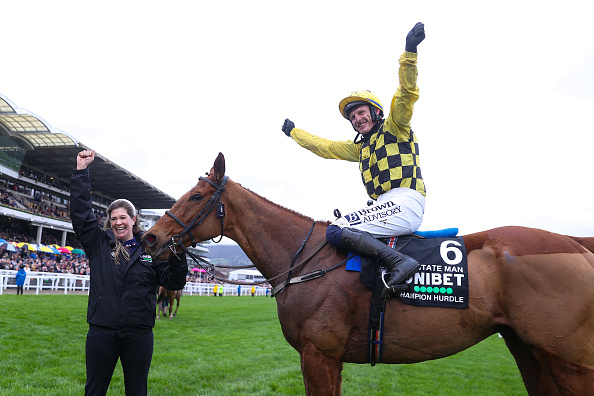 CHELTENHAM, ENGLAND - MARCH 12: Paul Townend celebrates victory on board State Man in The Unibet Champion Hurdle Challenge Trophy during day one of the Cheltenham Festival 2024 at Cheltenham Racecourse on March 12, 2024 in Cheltenham, England. (Photo by Michael Steele/Getty Images)
