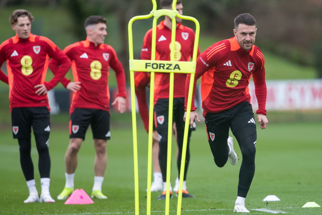 HENSOL, WALES - MARCH 20: Aaron Ramsey (R) warms up during the Wales Football Training Session at The Vale Resort on March 20, 2024 in Hensol, Wales. (Photo by Athena Pictures/Getty Images)