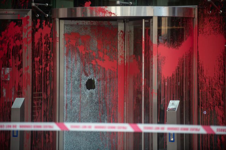 Red paint has been daubed on the offices of BNY Mellon by Palestine Action