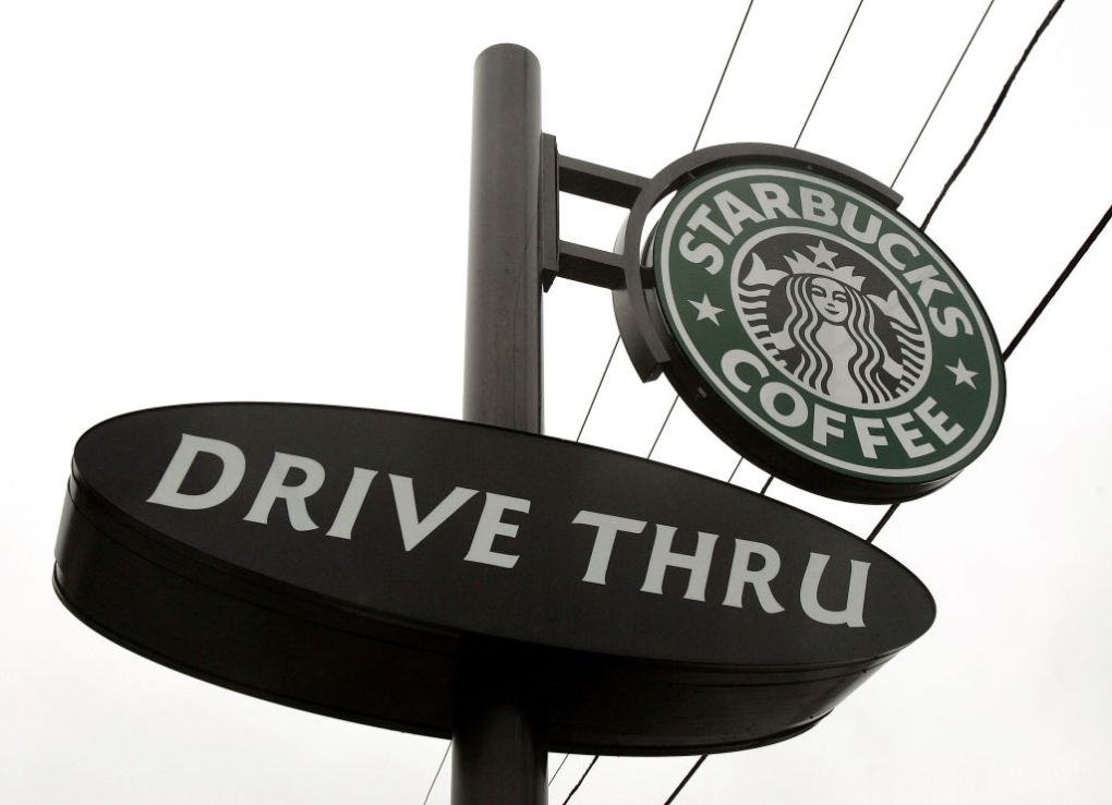 A Starbucks drive-thru sign is seen outside its store December 28, 2005 in Wheeling, Illinois. Starbucks opened 354 drive-thru stores in the U.S. in the past year, which brought for the first time, the number of new drive-thrus to comprise more than half of all new Starbucks company operated stores opened nationwide.  (Photo by Tim Boyle/Getty Images)