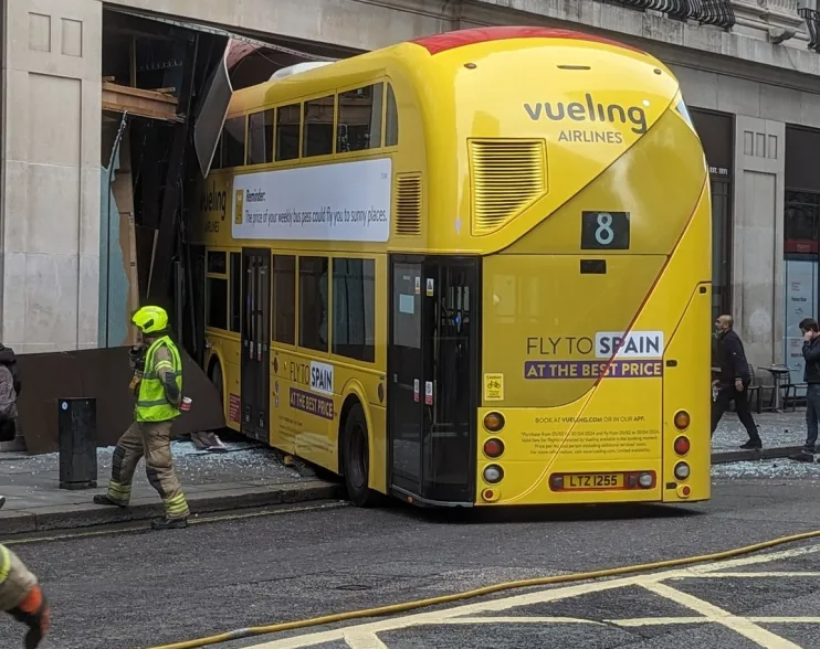 A double decker bus has crashed into a pub in central London's New Oxford Street. Emergency services were called to the scene shortly after 10am.