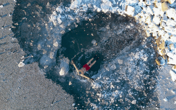 A man wild swimming in the Lake District. The destination is the focus of a new film on the rise of the hobby