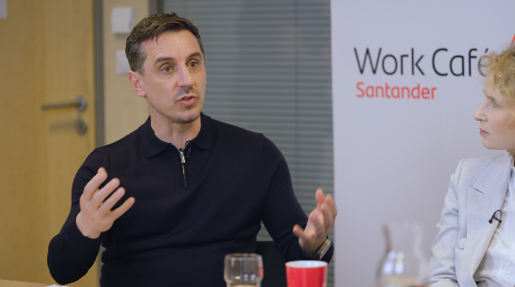 Gary Neville hosting a meeting at the Santander office in Warsaw, Poland.
