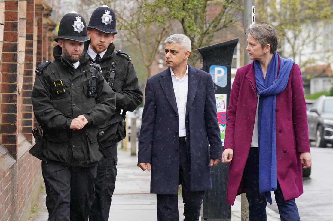 Sadiq Khan has been criticised for not delivering a planned ‘track my crime’ portal. Pictured, Khan and Yvette Cooper with two Met Police officers. Photo: PA