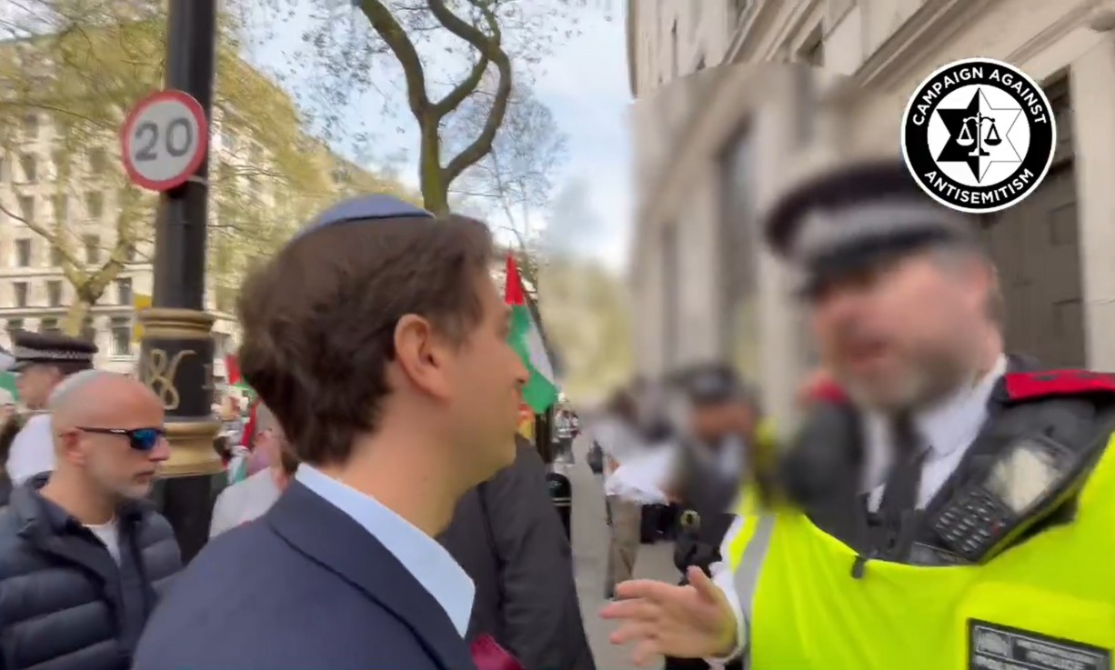 Screengrab from video taken with permission from the social media site X, formerly Twitter, posted by Campaign Against Antisemitism of their chief executive Gideon Falter speaking to a Metropolitan Police during a pro-Palestine march in London. Mr Falter, was wearing a kippah skull cap when he was stopped from crossing the road near the demonstration in the Aldwych area of London on Saturday afternoon. Photo credit : Campaign Against Antisemitism/PA Wire 
 