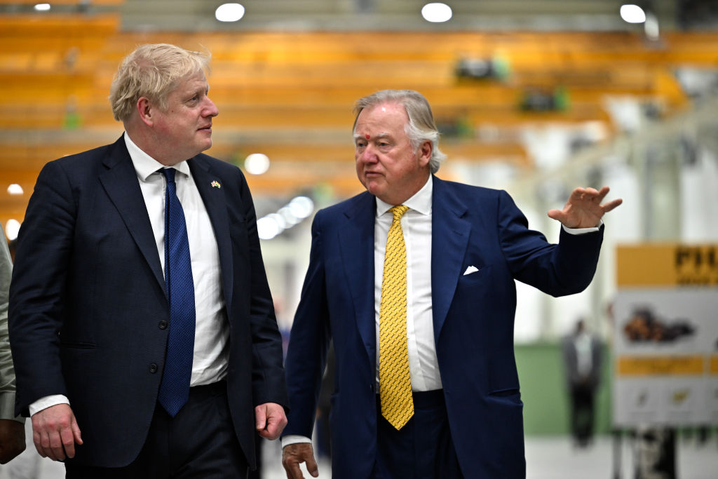 Then Prime Minister Boris Johnson with JCB chairman Lord Bamford during his visit at the JCB factory in Vadodara, Gujarat, during his two day trip to India on April 21, 2022. (Photo by Ben Stansall - WPA Pool/Getty Images)