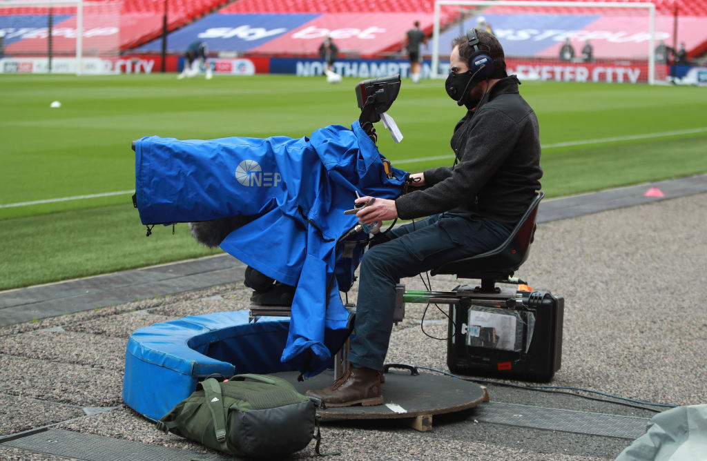 LONDON, ENGLAND - JUNE 29: A TV camera operator wears a mask during the Sky Bet League Two Play Off Final between Exeter City v Northampton Town at Wembley Stadium on June 29, 2020 in London, England. (Photo by David Rogers/Getty Images)