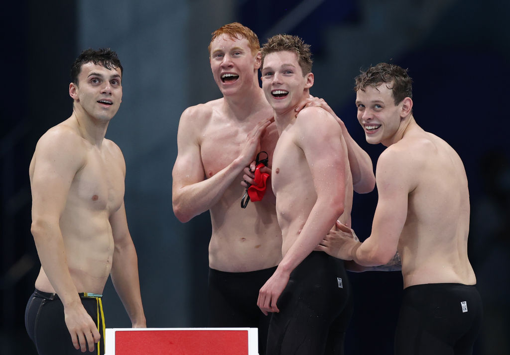 TOKYO, JAPAN - JULY 28: (L-R) James Guy, Tom Dean, Duncan Scott and Matthew Richards of Team Great Britain celebrate after winning the gold medal in the Men's 4 x 200m Freestyle Relay Final on day five of the Tokyo 2020 Olympic Games at Tokyo Aquatics Centre on July 28, 2021 in Tokyo, Japan. (Photo by Al Bello/Getty Images)