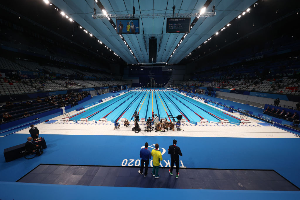 TOKYO, JAPAN - SEPTEMBER 02: A general view of the pool deck as bronze medalist Alexander Skaliukh of Team RPC, gold medalist William Martin of Team Australia and silver medalist Simone Barlaam of Team Italy pose during the men’s 100m Butterfly - S9 medal ceremony on day 9 of the Tokyo 2020 Paralympic Games at Tokyo Aquatics Centre on September 02, 2021 in Tokyo, Japan. (Photo by Dean Mouhtaropoulos/Getty Images)