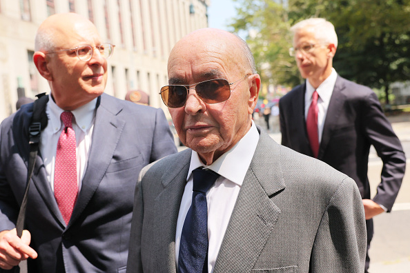 NEW YORK, NEW YORK - JULY 26: British billionaire owner of Tottenham Hotspur Joe Lewis is escorted by his attorneys after leaving Manhattan Federal Court on July 26, 2023 in New York City. Lewis turned himself in after being charged with orchestrating an insider trading scheme to enrich his friends, lovers and employees, including two private jet pilots.  (Photo by Michael M. Santiago/Getty Images)