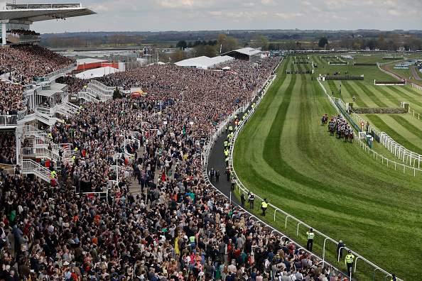 Runners in the second race, the Village Hotels Handicap Hurdle, pass the packed stands during racing on day three of the Grand National jump racing festival at Aintree Racecourse on April 15th 2023 in Liverpool, England (Photo by Tom Jenkins/Getty Images)