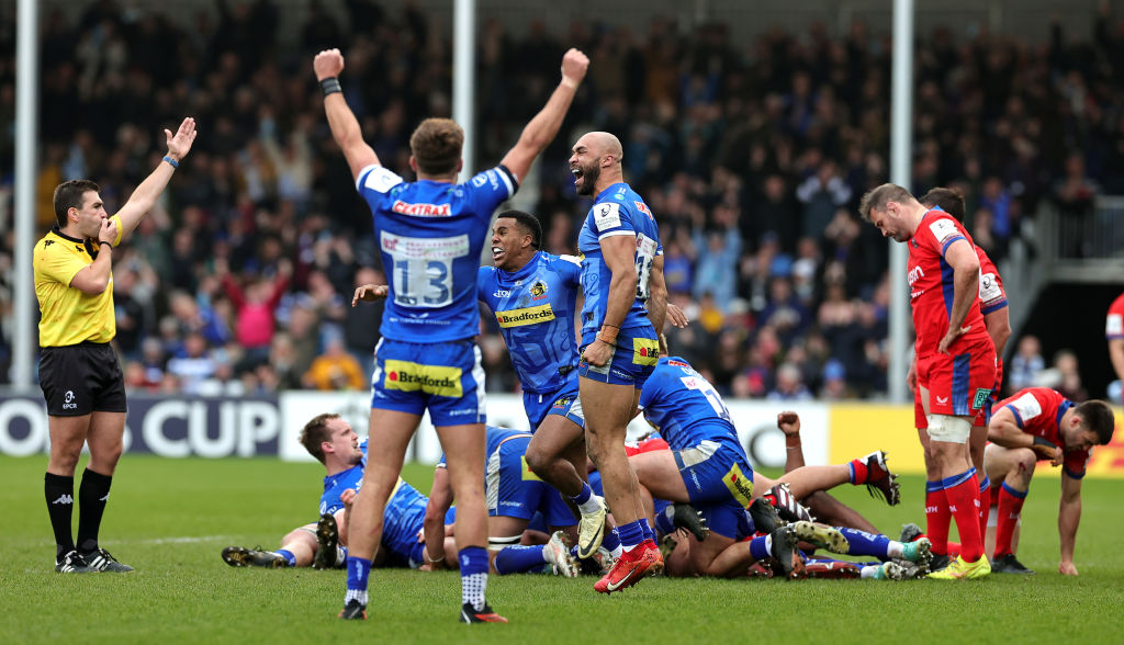 EXETER, ENGLAND - APRIL 06:  Olly Woodburn (C) of Exeter Chiefs celebrates victory with team mates Immanuel Feyi-Waboso  and Henry Slade at the final whistle during the Investec Champions Cup Round Of 16 match between Exeter Chiefs and Bath Rugby at Sandy Park on April 06, 2024 in Exeter, England. (Photo by David Rogers/Getty Images)