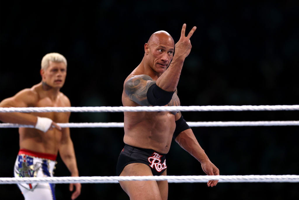 PHILADELPHIA, PENNSYLVANIA - APRIL 06: Dwayne "The Rock" Johnson reacts during a tag team fight with Romain Reigns against Cody Rhodes and Seth "Freakin" Rollins during Night One of WrestleMania 40 at Lincoln Financial Field on April 06, 2024 in Philadelphia, Pennsylvania.  (Photo by Tim Nwachukwu/Getty Images)