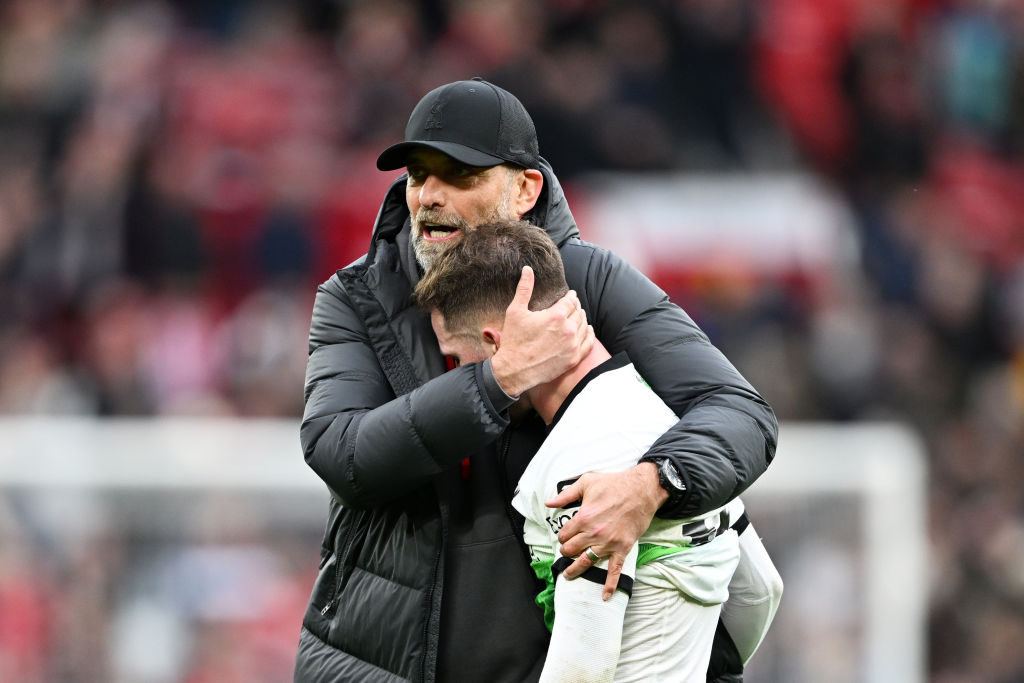 MANCHESTER, ENGLAND - APRIL 07: Jurgen Klopp, Manager of Liverpool, embraces Alexis Mac Allister of Liverpool after the Premier League match between Manchester United and Liverpool FC at Old Trafford on April 07, 2024 in Manchester, England. (Photo by Michael Regan/Getty Images)