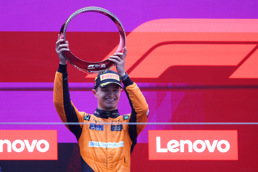 SHANGHAI, CHINA - APRIL 21: Second placed Lando Norris of Great Britain and McLaren celebrates with trophy on the podium during the F1 Grand Prix of China at Shanghai International Circuit on April 21, 2024 in Shanghai, China. (Photo by Lars Baron/Getty Images)