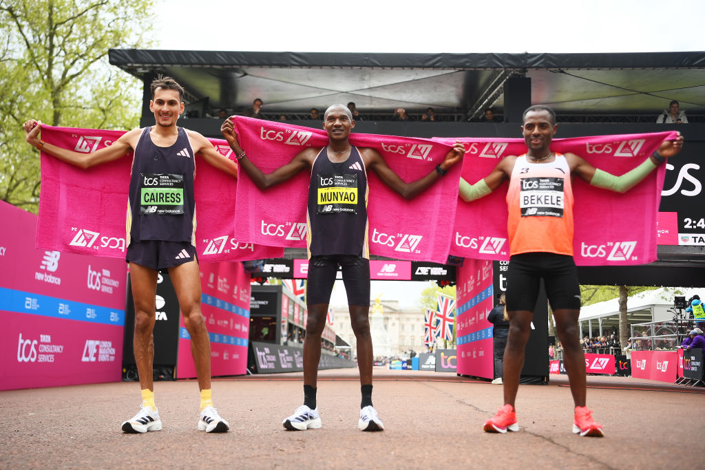 LONDON, ENGLAND - APRIL 21: (L to R) Third placed Emile Cairess of Great Britain, first placed Alexander Mutiso Munyao of Kenya, second placed Kenyaenisa Bekele of Ethiopia celebrate after the Men's elite race during the 2024 TCS London Marathon on April 21, 2024 in London, England. (Photo by Alex Davidson/Getty Images)