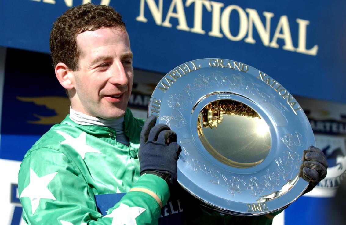 Jim Culloty celebrates after winning the 2002 Grand National on Bindaree