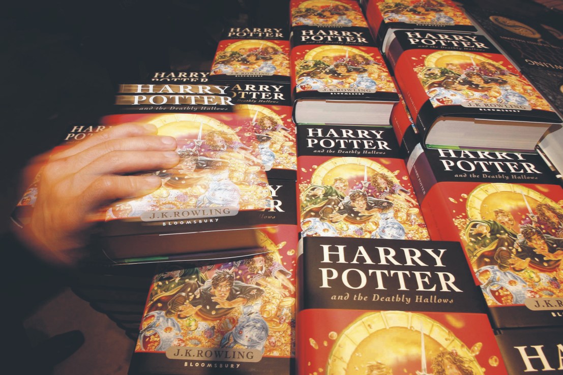 Consumer revenue increased 49 per cent, fuelled by literary success, in particular by sales of J. Maas's fantasy  fiction books. (Harry Potter fans grab copies of the new and final Harry Potter book.)
