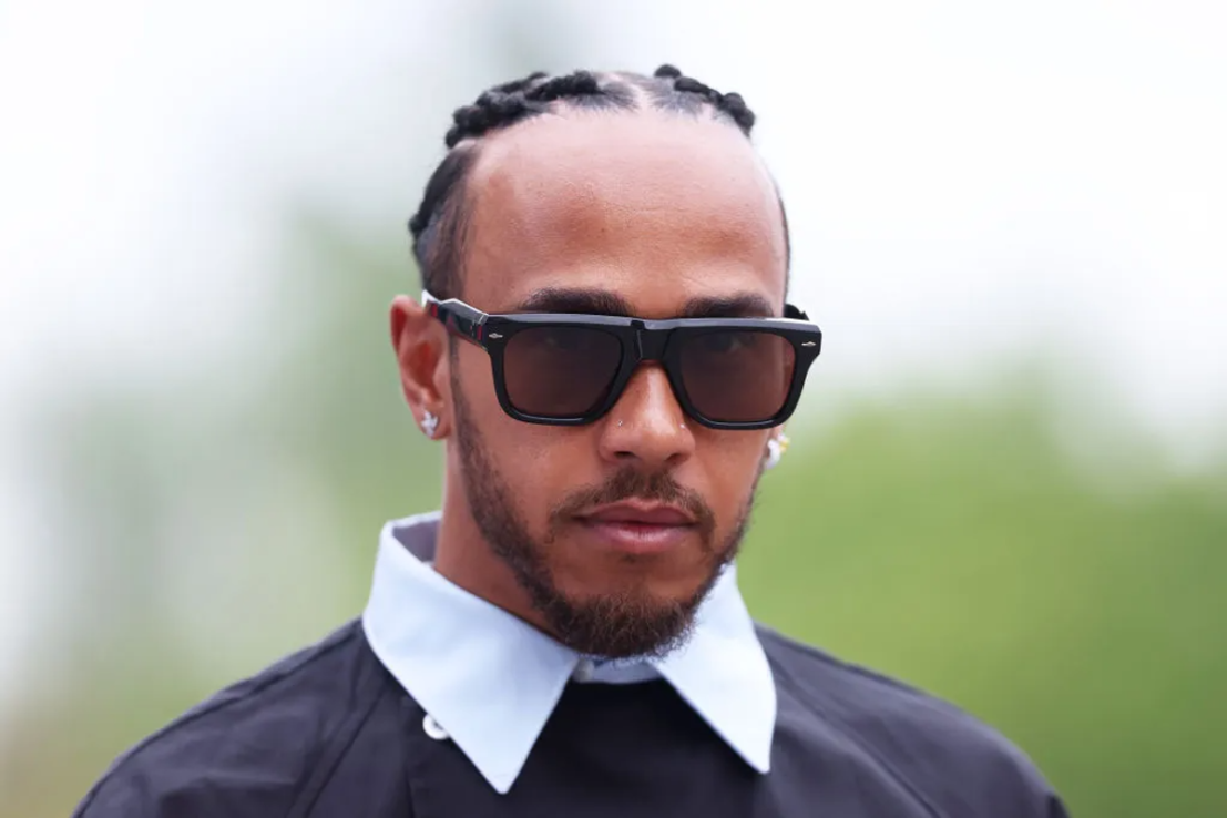 IMOLA, ITALY - MAY 16: Lewis Hamilton of Great Britain and Mercedes walks in the Paddock during previews ahead of the F1 Grand Prix of Emilia-Romagna at Autodromo Enzo e Dino Ferrari Circuit on May 16, 2024 in Imola, Italy. (Photo by Lars Baron/Getty Images)
