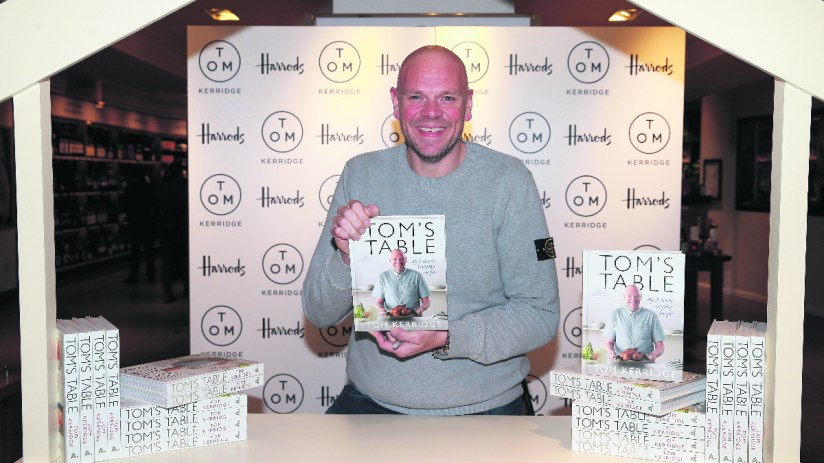 LONDON, ENGLAND - SEPTEMBER 23: Chef Tom Kerridge poses with a copy of his book "Tom's Table: My Favourite Recipes" a Bloomsbury title at Harrods on September 23, 2015 in London, England. (Photo by Chris Jackson/Getty Images)
