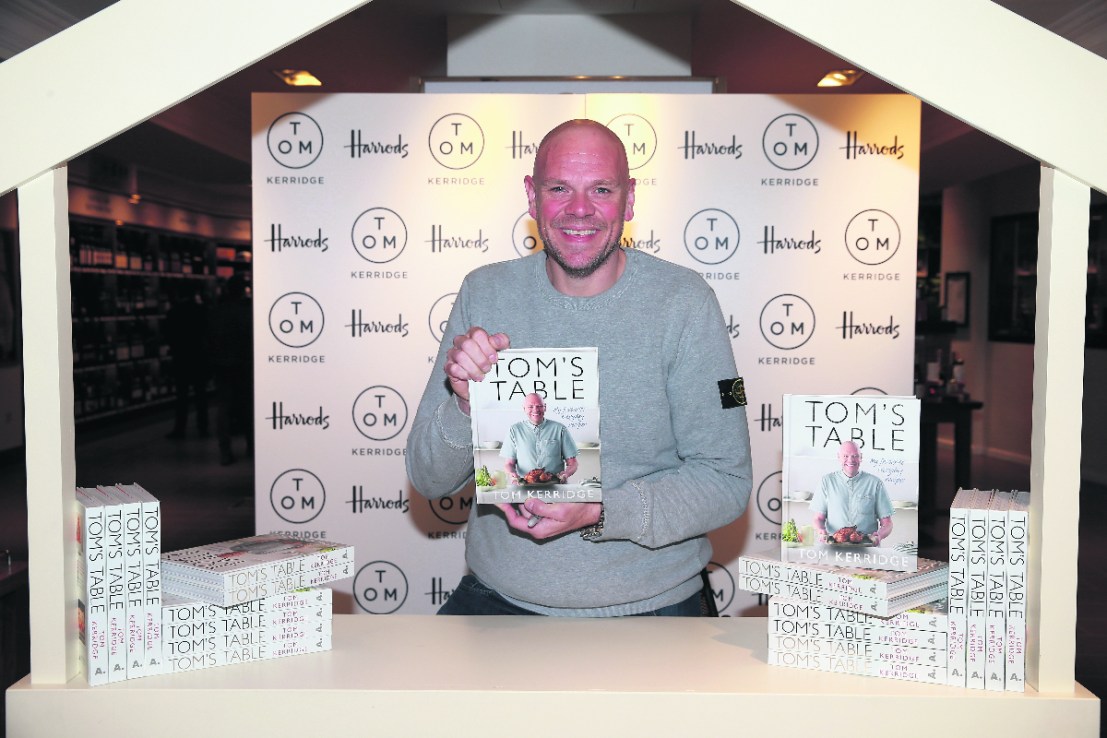 LONDON, ENGLAND - SEPTEMBER 23:  Chef  Tom Kerridge poses with a copy of his book "Tom's Table: My Favourite Recipes" a Bloomsbury title at Harrods on September 23, 2015 in London, England.  (Photo by Chris Jackson/Getty Images)