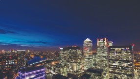 Canary Wharf skyline, highlighting the financial district, related to QFEX launch by Cambridge graduates in trading sector