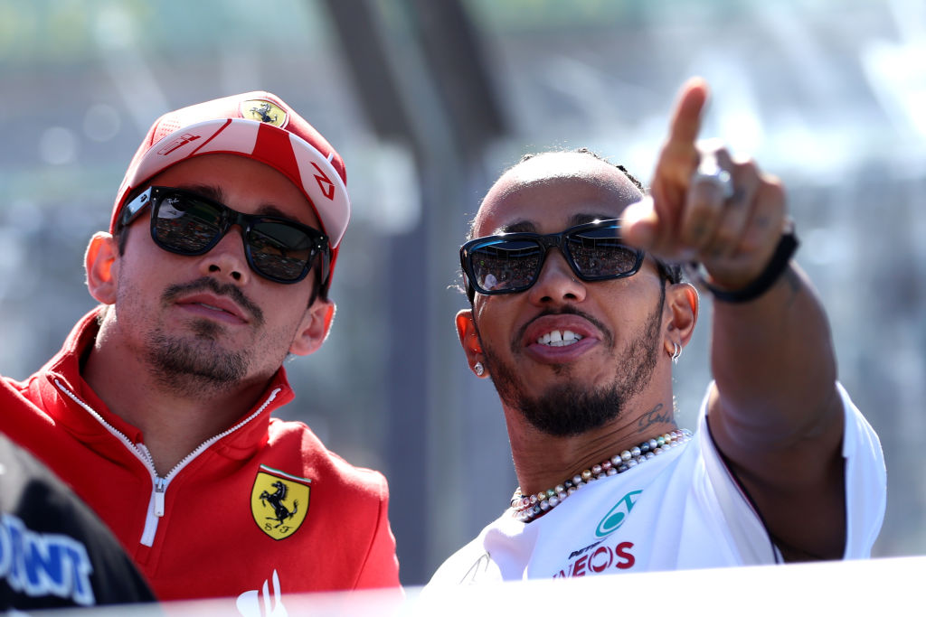 MELBOURNE, AUSTRALIA - MARCH 24: Charles Leclerc of Monaco and Ferrari and Lewis Hamilton of Great Britain and Mercedes talk on the drivers parade prior to the F1 Grand Prix of Australia at Albert Park Circuit on March 24, 2024 in Melbourne, Australia. (Photo by Robert Cianflone/Getty Images)