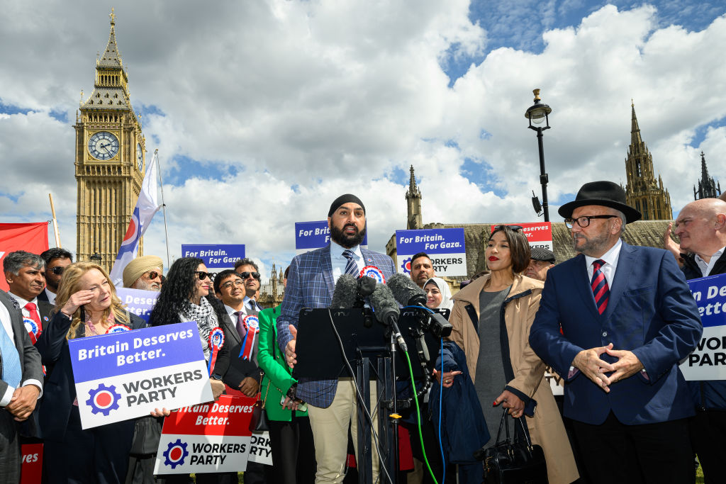 Leader of the Workers Party of Britain George Galloway (R) looks on as former England cricketer Monty Panesar (C) addresses fellow party candidates in Parliament Square on April 30, 2024 in London, England. (Photo by Leon Neal/Getty Images)