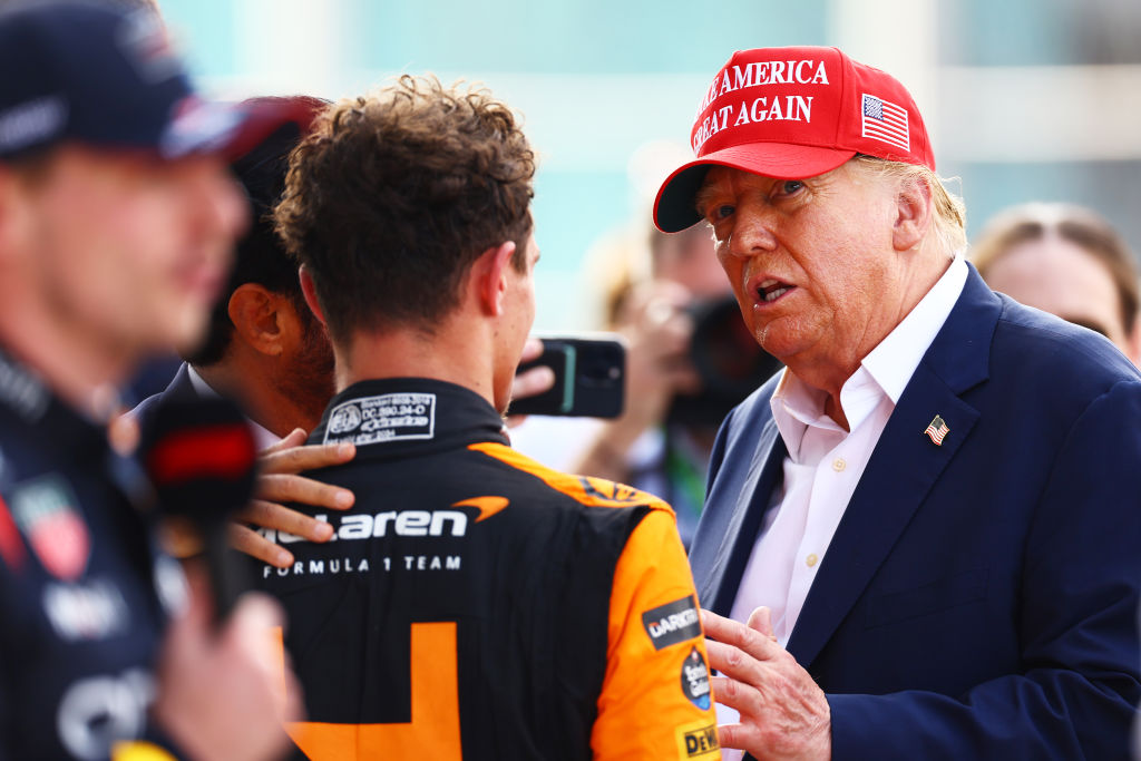 MIAMI, FLORIDA - MAY 05: Donald Trump talks with Race winner Lando Norris of Great Britain and McLaren in parc ferme during the F1 Grand Prix of Miami at Miami International Autodrome on May 05, 2024 in Miami, Florida. (Photo by Mark Thompson/Getty Images)