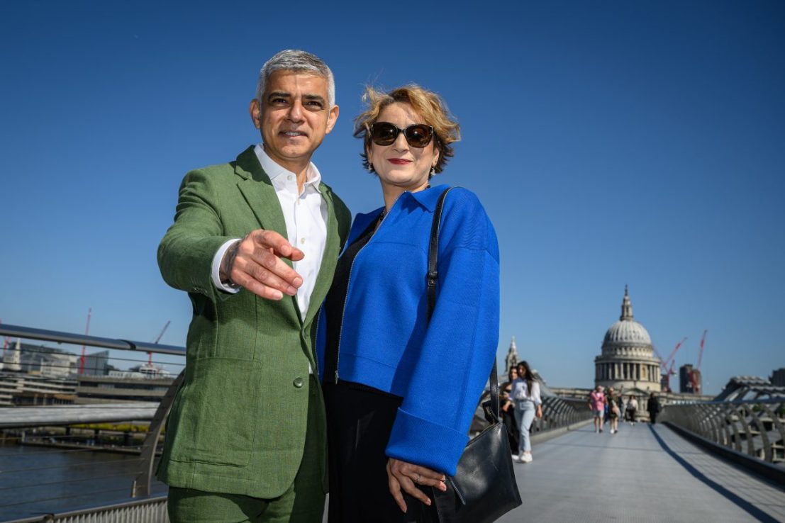 LONDON, ENGLAND - MAY 7: London Mayor Sadiq Khan and his wife Saadiya Khan pose for photos as they walk across the Millennium Bridge ahead of his swearing in for a third term on May 7, 2024 in London, England. (Photo by Leon Neal/Getty Images)