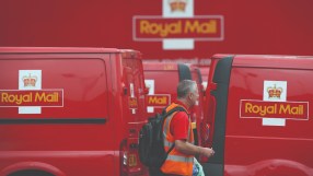 Royal Mail delivery van outside a postal depot, representing the &pound;21m fine by Ofcom for late mail deliveries.