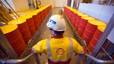 Shell CEO Wael Sawan in a boardroom setting, highlighting his reported &pound;4.5m pay boost under new remuneration policy.