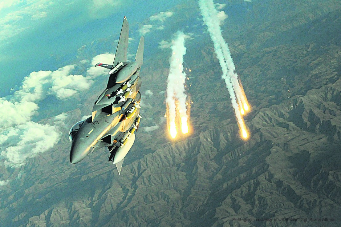An F-15E Strike Eagle deploys countermeasure flairs over Afghanistan.  . (U.S. Air Force photo/Staff Sgt. Aaron Allmon) 