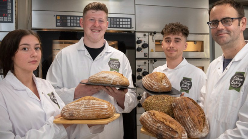 A French bread maker has purchased a controlling stake in Village Bakery.